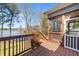 Spacious outdoor deck offers stunning lake views and access to a screened-in porch, perfect for relaxing outdoors at 1013 Sagamore Dr, Louisburg, NC 27549