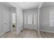 Bright foyer features decorative glass front door and neutral paint, creating an inviting entrance to the home at 1013 Sagamore Dr, Louisburg, NC 27549