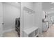 Charming mudroom with built-in storage, bench, and laundry area, enhancing functionality and convenience at 1013 Sagamore Dr, Louisburg, NC 27549