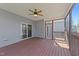 Cozy screened-in porch with ceiling fan at 1013 Sagamore Dr, Louisburg, NC 27549