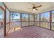 Screened-in porch with ceiling fan providing gorgeous lake views at 1013 Sagamore Dr, Louisburg, NC 27549