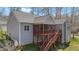 Back of house featuring a screened in porch, wood deck, and well-maintained lawn at 1013 Sagamore Dr, Louisburg, NC 27549
