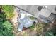 Aerial shot highlighting the expansive deck and private backyard nestled among mature trees at 107 E Seve Ct, Morrisville, NC 27560