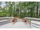 Well-maintained back deck offering a serene view of the surrounding trees and greenery at 107 E Seve Ct, Morrisville, NC 27560
