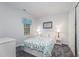 This bedroom offers neutral walls, carpet, and a window with a decorative valance at 107 E Seve Ct, Morrisville, NC 27560