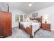 Comfortable bedroom featuring a vaulted ceiling, ceiling fan, and wood furnishings at 107 E Seve Ct, Morrisville, NC 27560
