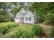 Two-story home featuring a lush, landscaped front yard, attached two-car garage, and inviting front entrance at 107 E Seve Ct, Morrisville, NC 27560