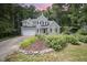 Well-maintained two-story home featuring a lush, landscaped front yard and attached two-car garage at 107 E Seve Ct, Morrisville, NC 27560