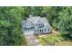 Charming two-story home featuring a lush, landscaped front yard and attached two-car garage at 107 E Seve Ct, Morrisville, NC 27560