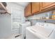 Well-equipped laundry room with modern appliances and ample storage at 107 E Seve Ct, Morrisville, NC 27560