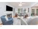 Inviting living room boasts a fireplace, plush seating, and natural light streaming through the windows at 107 E Seve Ct, Morrisville, NC 27560