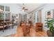 Bright living room featuring wood floors, high ceilings, large windows, and comfortable seating arrangements at 107 E Seve Ct, Morrisville, NC 27560