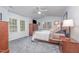 Serene main bedroom with carpet floors, vaulted ceiling, and natural light at 107 E Seve Ct, Morrisville, NC 27560