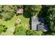 Birds eye view of backyard with garden, brick patio, and mature trees at 108 High St, Carrboro, NC 27510