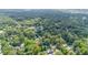 Overhead shot showcasing the neighborhood and surrounding lush greenery at 108 High St, Carrboro, NC 27510