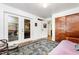 Spacious bedroom with access to the screened in deck, a large closet, and wood flooring at 108 High St, Carrboro, NC 27510