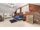 Unique upstairs bedroom with decorative wood paneling, ample closet space, and a ceiling fan at 108 High St, Carrboro, NC 27510