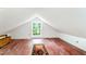 Upstairs bonus room with hardwood floors, a bright window, and space for customization at 108 High St, Carrboro, NC 27510