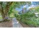 Quaint two-story home featuring a brick walkway and lush landscaping at 108 High St, Carrboro, NC 27510