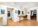 Eat-in kitchen with desk nook and view into dining and living areas at 108 High St, Carrboro, NC 27510