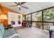 Relaxing screened-in porch featuring wood ceiling, ceiling fan, and views of the outdoors at 108 High St, Carrboro, NC 27510