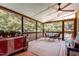 Inviting screened porch with string lights, a ceiling fan, and comfortable outdoor seating at 108 High St, Carrboro, NC 27510