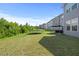 Spacious backyard with green lawn, trampoline, and outdoor seating area, perfect for entertaining and Gathering fun at 120 Misty Grove Trail Trl, Franklinton, NC 27525