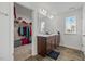 Bathroom featuring a double sink vanity and access to a closet with an abundance of storage space at 120 Misty Grove Trail Trl, Franklinton, NC 27525