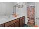 Bathroom with double vanity and colorful peach theme decorations at 120 Misty Grove Trail Trl, Franklinton, NC 27525