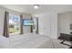 Bright bedroom features a comfortable bed and a television mounted on the wall for easy viewing at 120 Misty Grove Trail Trl, Franklinton, NC 27525