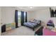 Bright bedroom featuring a playful cartoon themed bed and modern black out curtains at 120 Misty Grove Trail Trl, Franklinton, NC 27525
