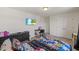 Bright bedroom featuring a playful cartoon themed bed and an ensuite bathroom at 120 Misty Grove Trail Trl, Franklinton, NC 27525
