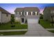 Charming two-story home with gray siding, black shutters, and well-manicured front yard at 120 Misty Grove Trail Trl, Franklinton, NC 27525