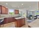 Modern kitchen with granite countertops, stainless steel appliances, and a view to the living area at 120 Misty Grove Trail Trl, Franklinton, NC 27525