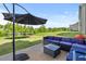 Patio featuring outdoor furniture, a trampoline, lush green lawn, and open space at 120 Misty Grove Trail Trl, Franklinton, NC 27525