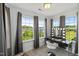 Vanity Room featuring natural light from multiple windows and a modern makeup vanity with illuminated mirror at 120 Misty Grove Trail Trl, Franklinton, NC 27525