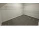 A well-organized walk-in closet featuring wire shelving and plush carpeting at 129 Hot Springs Way, Benson, NC 27504