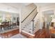 Bright foyer featuring hardwood floors, staircase and decorative millwork throughout at 1313 Duplin Rd, Raleigh, NC 27607