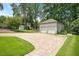 Detached two car garage with a basketball hoop and playset in the background at 1313 Duplin Rd, Raleigh, NC 27607