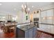 Spacious kitchen featuring gas cooktop, stainless appliances and hardwood floors at 1313 Duplin Rd, Raleigh, NC 27607