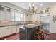 Gourmet kitchen boasting custom cabinetry, granite countertops, and stainless steel appliances at 1313 Duplin Rd, Raleigh, NC 27607