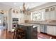 Well-appointed kitchen boasting granite countertops, hardwood floors and stainless appliances at 1313 Duplin Rd, Raleigh, NC 27607