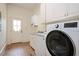 Well-equipped laundry room with modern appliances and ample storage at 1313 Duplin Rd, Raleigh, NC 27607