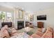 Cozy living room with fireplace, built-in bookshelves, and comfortable seating at 1313 Duplin Rd, Raleigh, NC 27607
