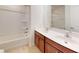 Bathroom with a double sink vanity, a shower and tub combination, tiled floors and neutral walls at 1365 Scholar Dr, Durham, NC 27703