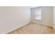 Neutral bedroom featuring neutral walls, neutral carpet and a window with blinds at 1365 Scholar Dr, Durham, NC 27703