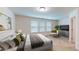 Inviting bedroom with natural light, neutral tones, and a comfortable bed with stylish linens at 1365 Scholar Dr, Durham, NC 27703