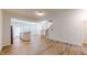 Open floor plan showcasing the kitchen, staircase, and dining area with abundant natural light at 1365 Scholar Dr, Durham, NC 27703