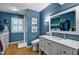Well-lit bathroom showcasing modern fixtures, a large mirror, and a walk-in shower at 1426 Kildaire Farm Rd, Cary, NC 27511