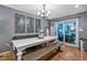 Bright dining area featuring a long white table and direct access to outdoor space at 1426 Kildaire Farm Rd, Cary, NC 27511